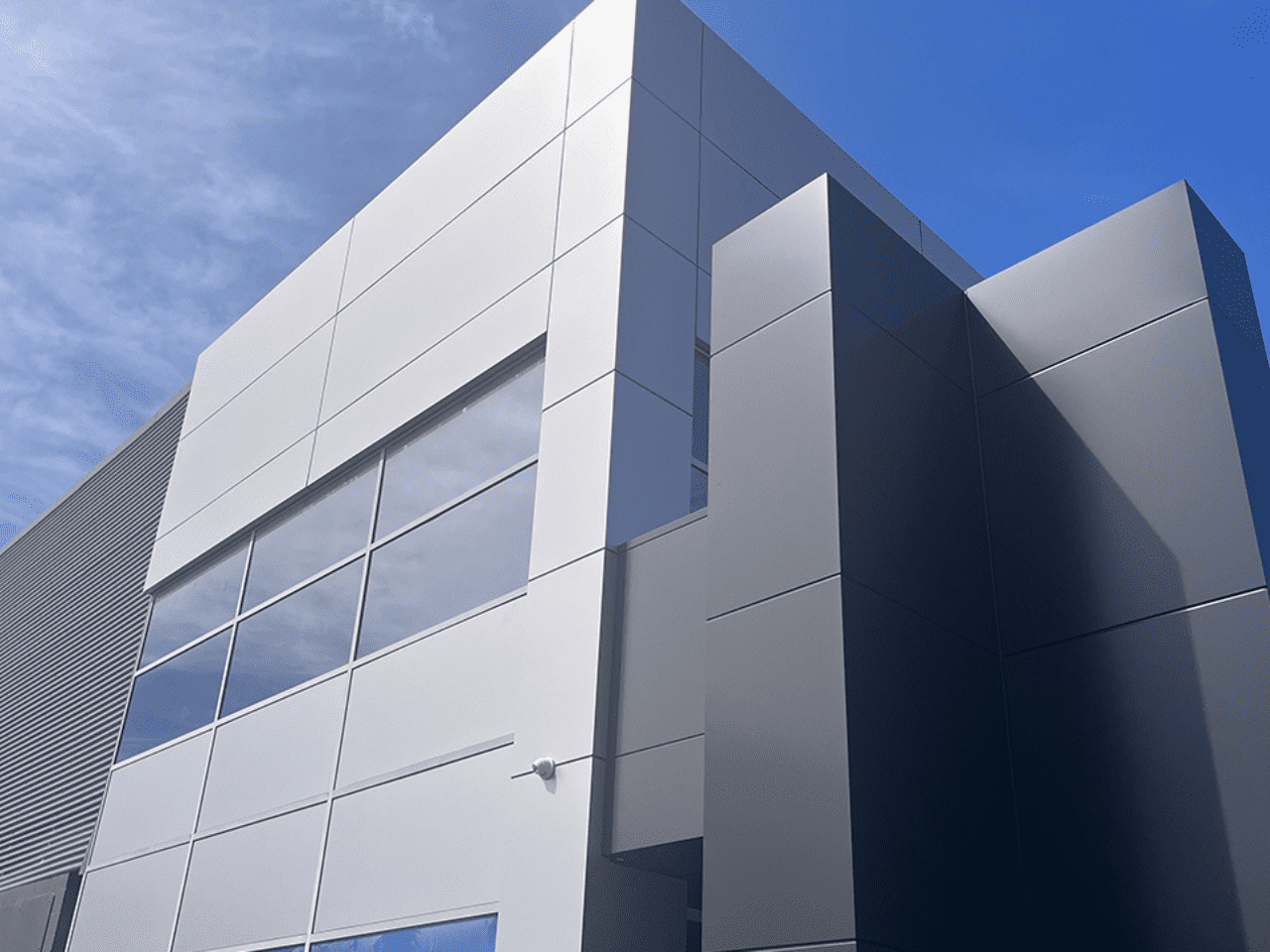 Modern façade of Fraternity Club, Wollongong, showcasing sustainable aluminium cladding.