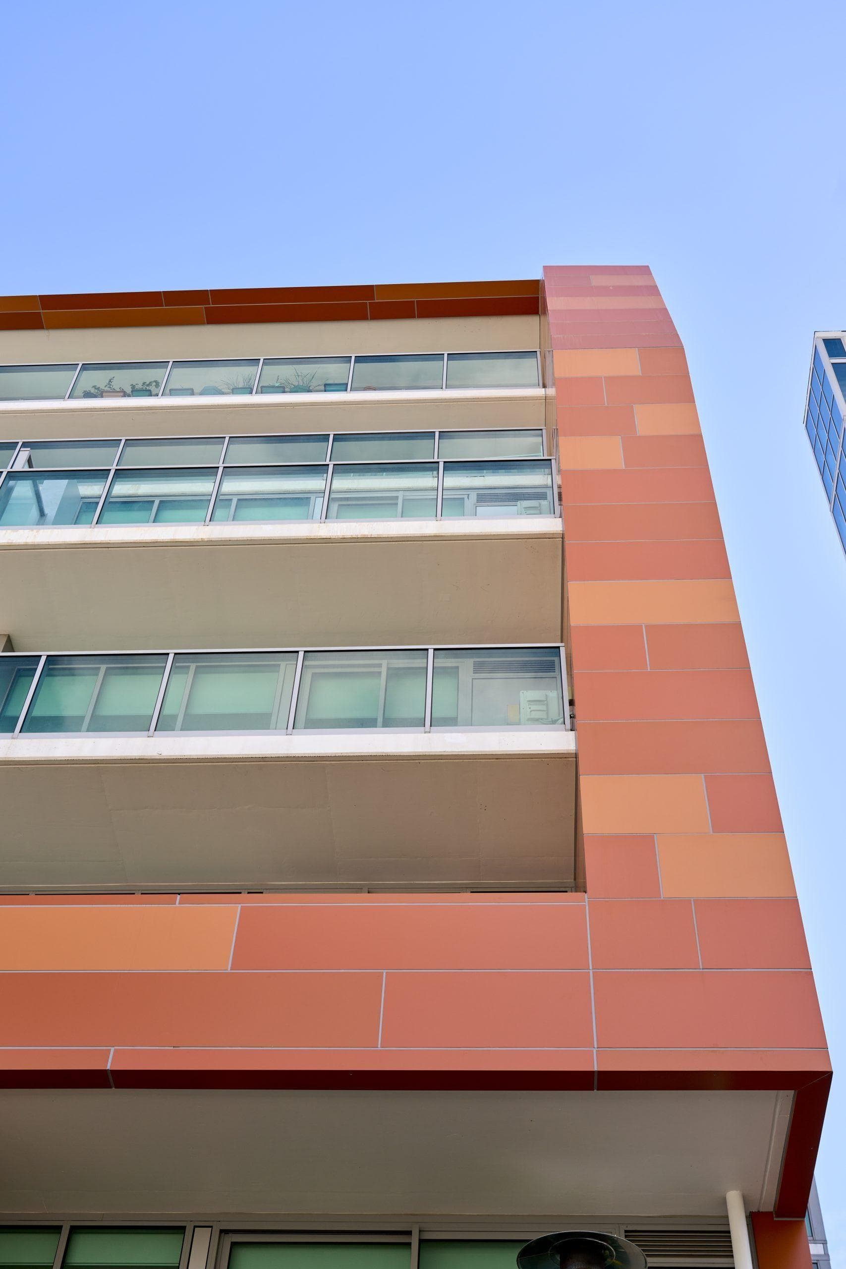 Upper façade of Trilogi Apartments showing ALPOLIC™ aluminium cladding and balcony integration