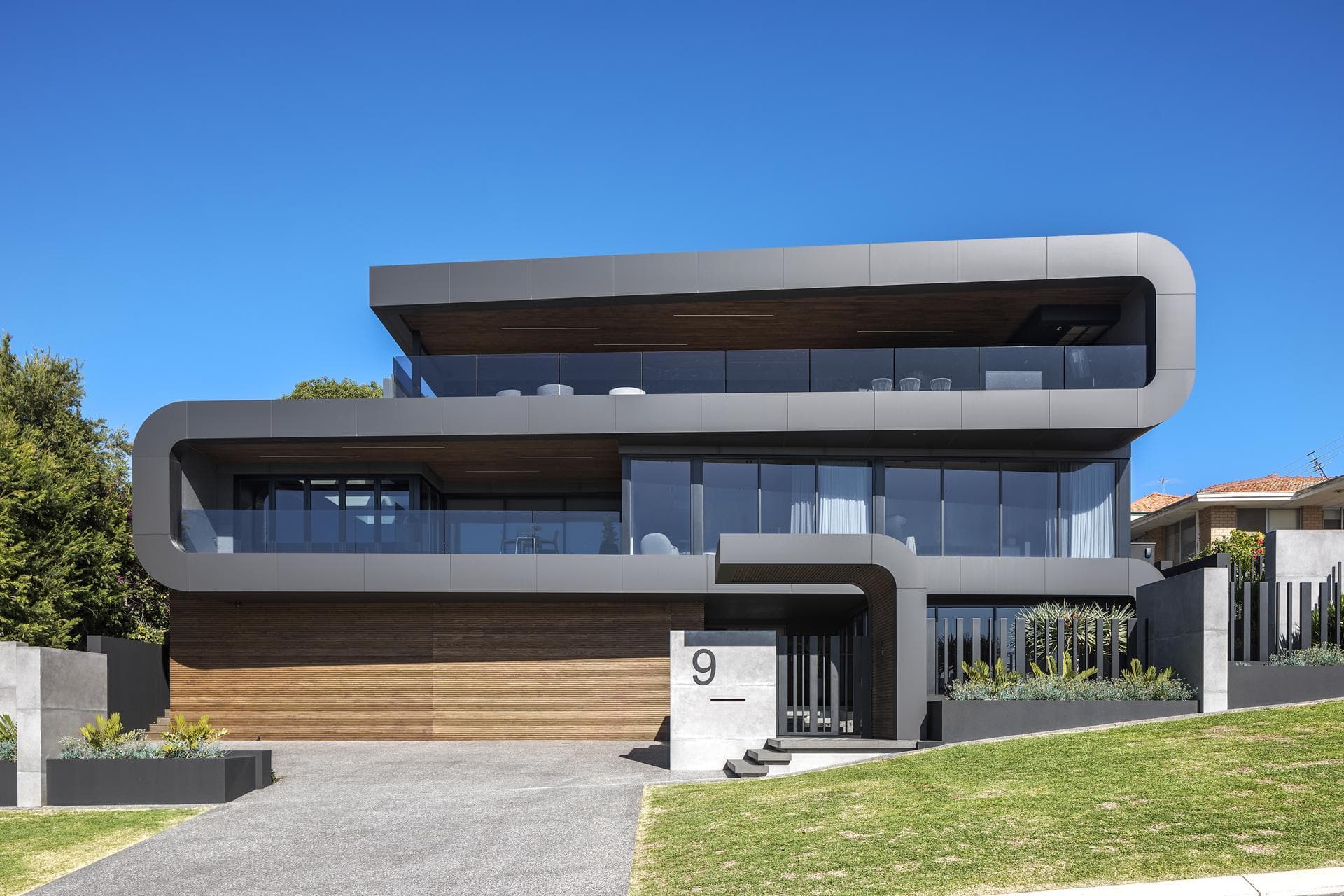 Front elevation of 9 Stoke Street showing sleek ALPOLIC™/fr Matte Slate Black façade and glass balconies